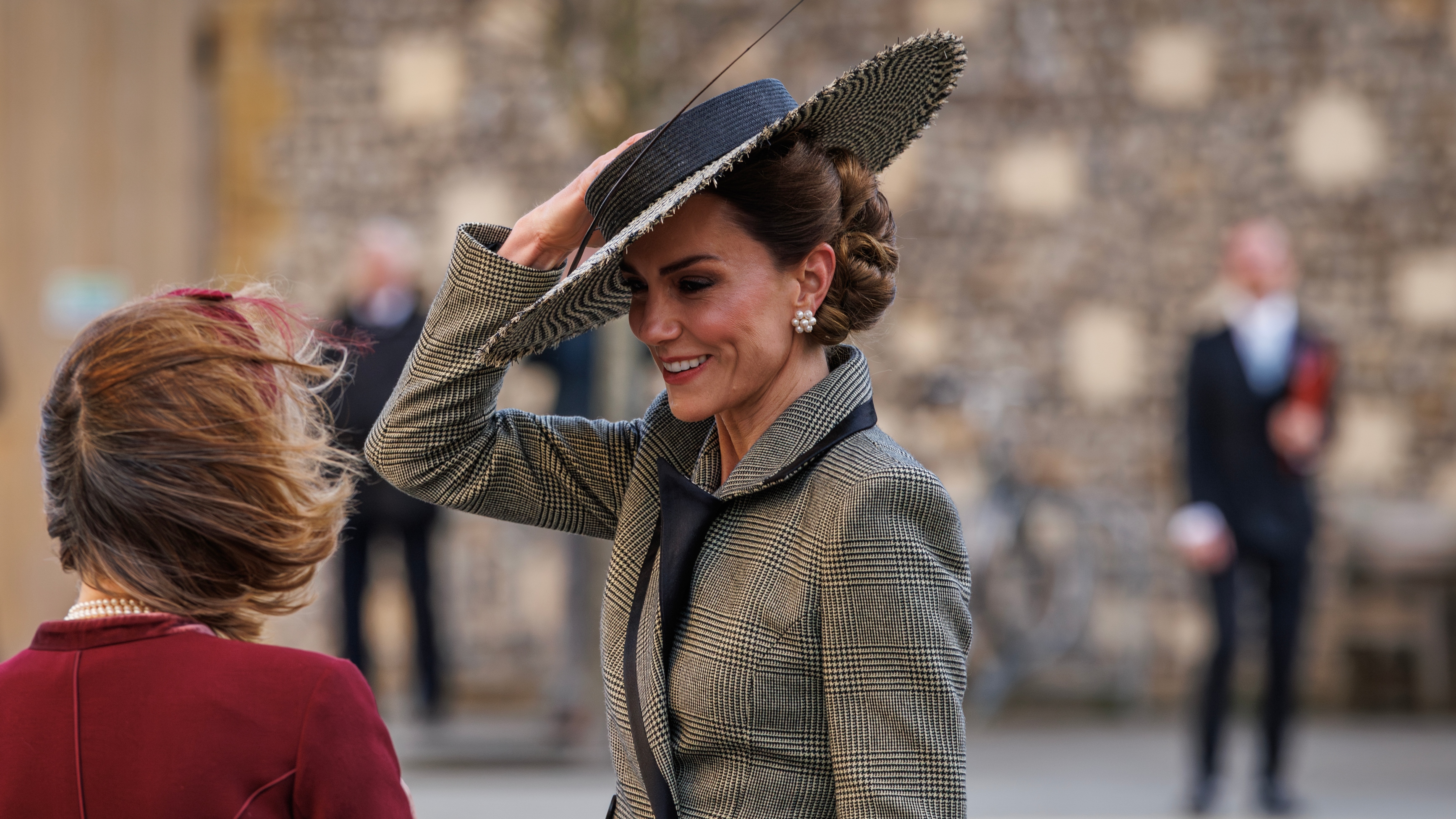 Catherine, Princess of Wales holds on to her hat as she leaves after Dame Sarah Mullally was installed as the first ever female leader of the Church of England on March 25, 2026