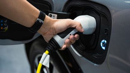 Hand charging an electric car