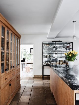 brigette romanek's kitchen with wood cabinets and open shelving