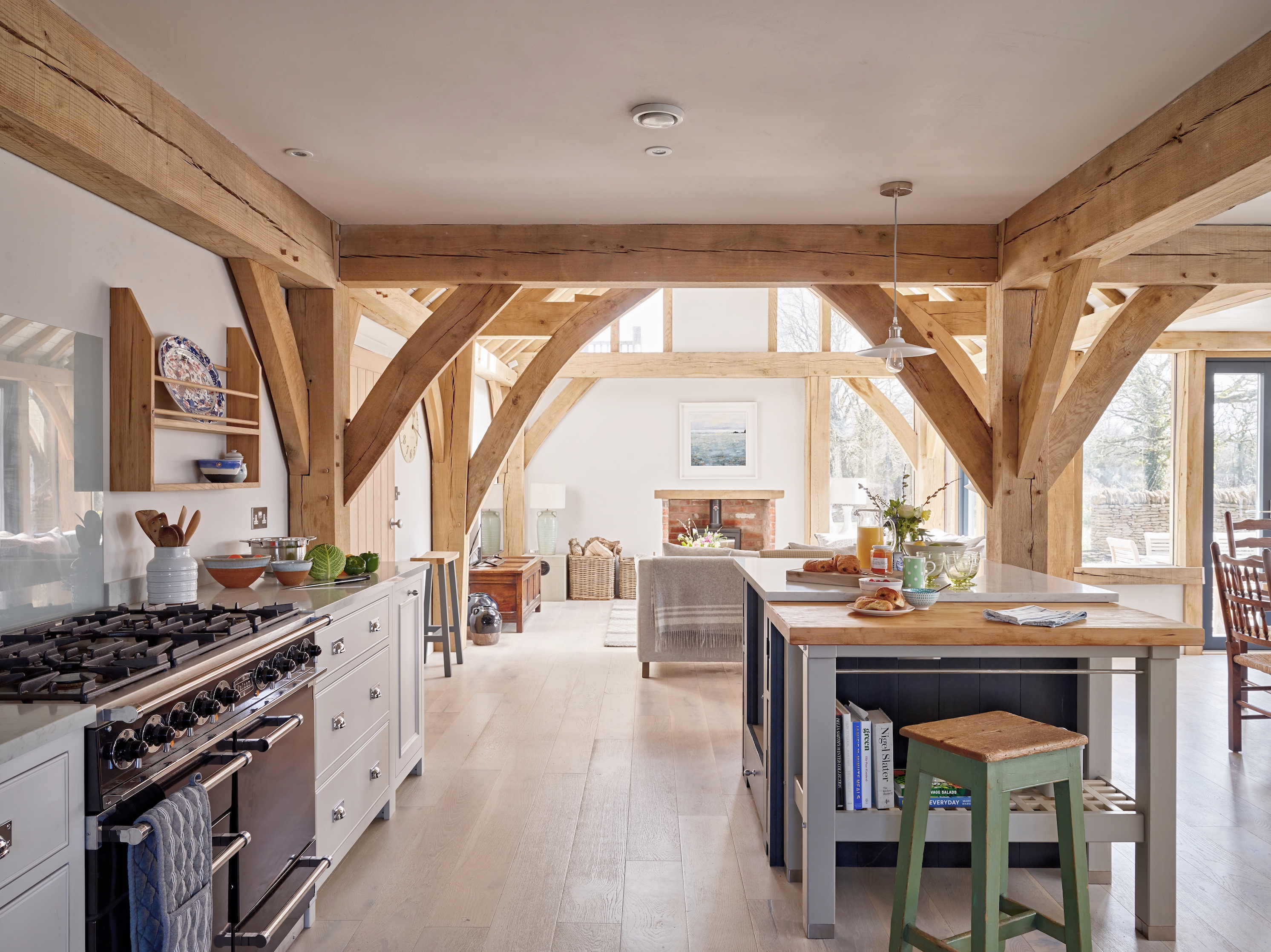 open plan kitchen with island in a large oak frame house
