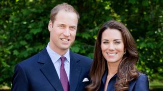 Prince William and Kate Middleton pose for the official tour portrait for their trip to Canada and California in the Garden's of Clarence House on June 3, 2011 in London. England