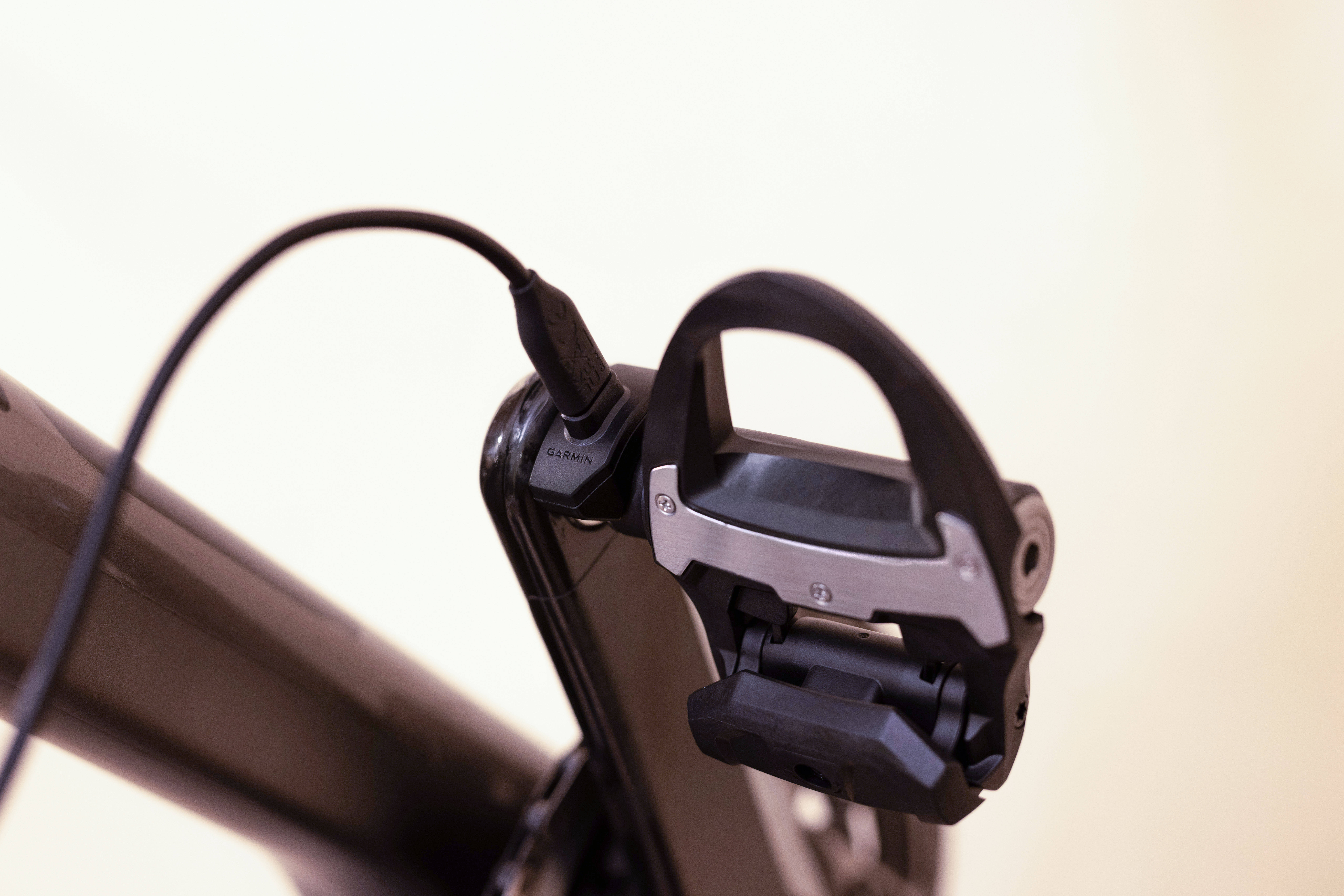 A Garmin power meter pedal recharging