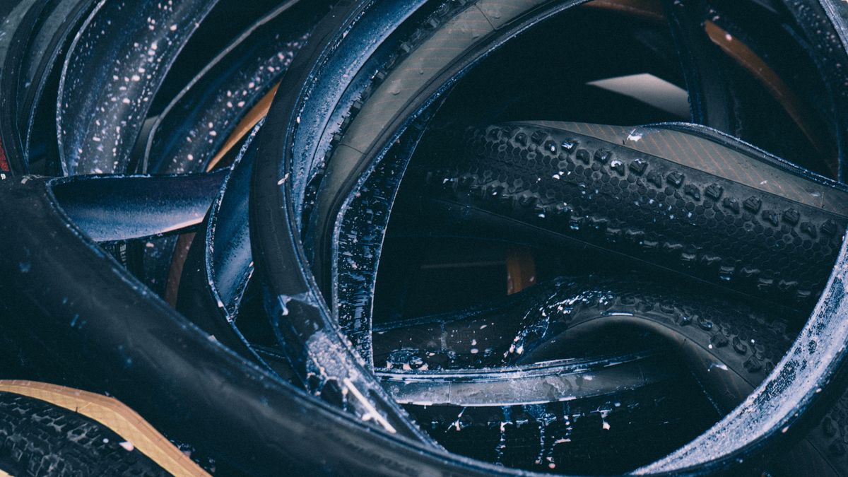 Tubeless tyres in a pile covered in sealant 