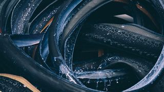 Tubeless tyres in a pile covered in sealant 