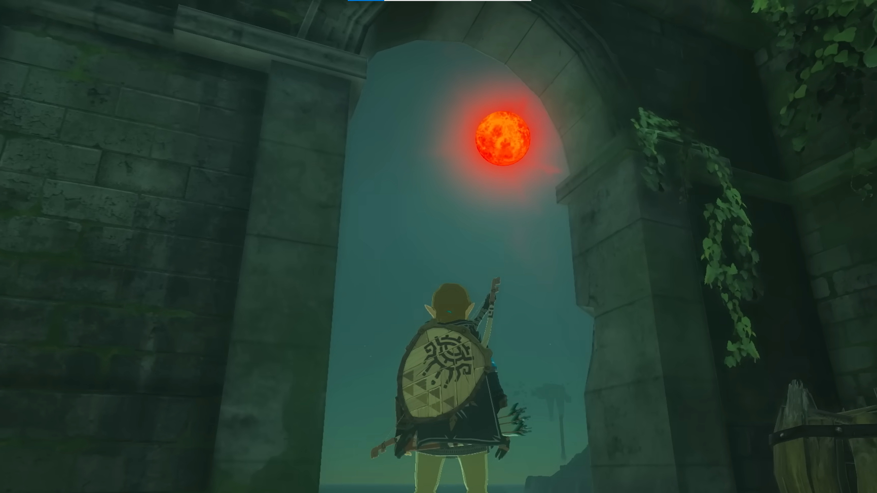 Link standing in ruins, staring at the blood moon