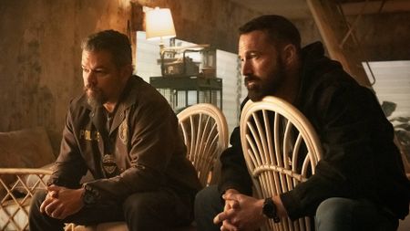 Matt Damon and Ben Affleck sitting on chairs in The Rip