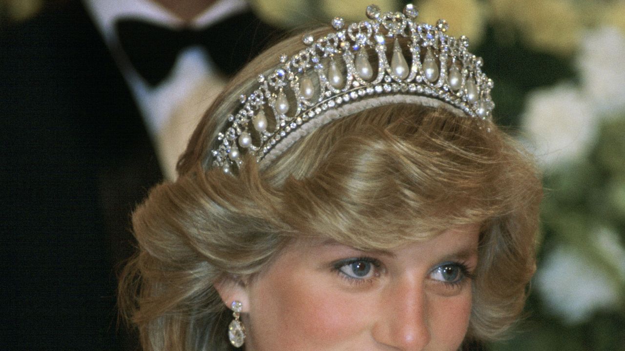 new zealand april 29 princess diana at a banquet in new zealand wearing the cambridge knot tiara queen marys tiara with diamond earrings her cream silk organza evening dress is designed by fashion designer gina fratini photo by tim graham photo library via getty images