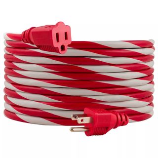 A red and white candy cane striped extension cord