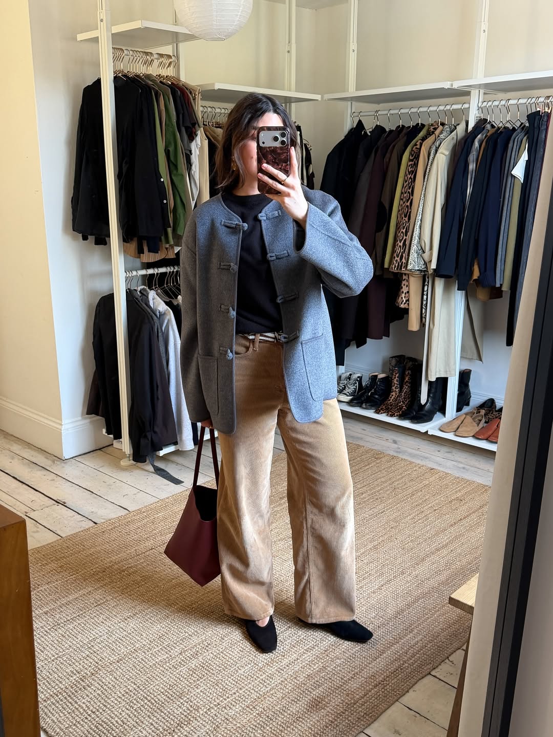 Influencer Anna Newton wearing corduroy trousers and a wool jacket.