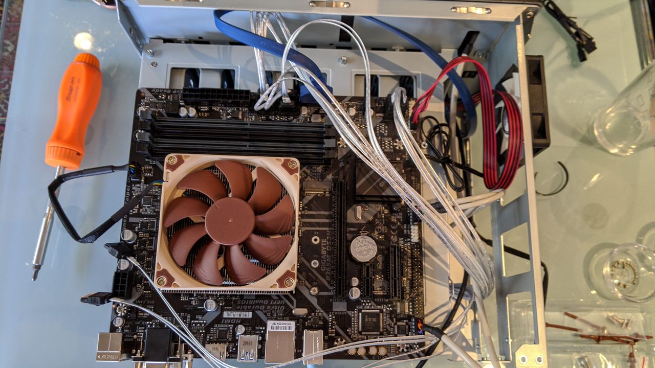 There are a lot of very long SATA cables here, which run from the control boards at the back of the case that the HDDs slide into.