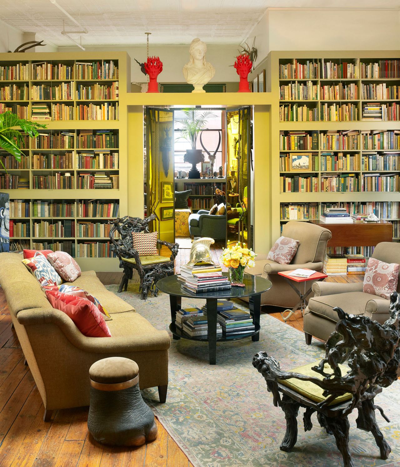 Shelves with books, armchairs and sofa