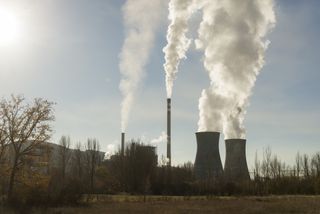 Carbon footprint: An image of a factory burning fossil fuels
