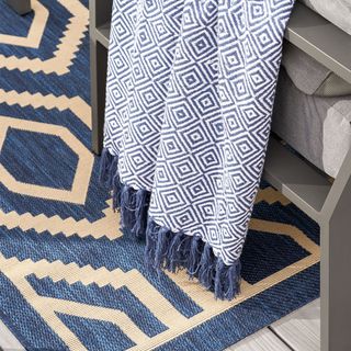 Close up of blue and white outdoor rug