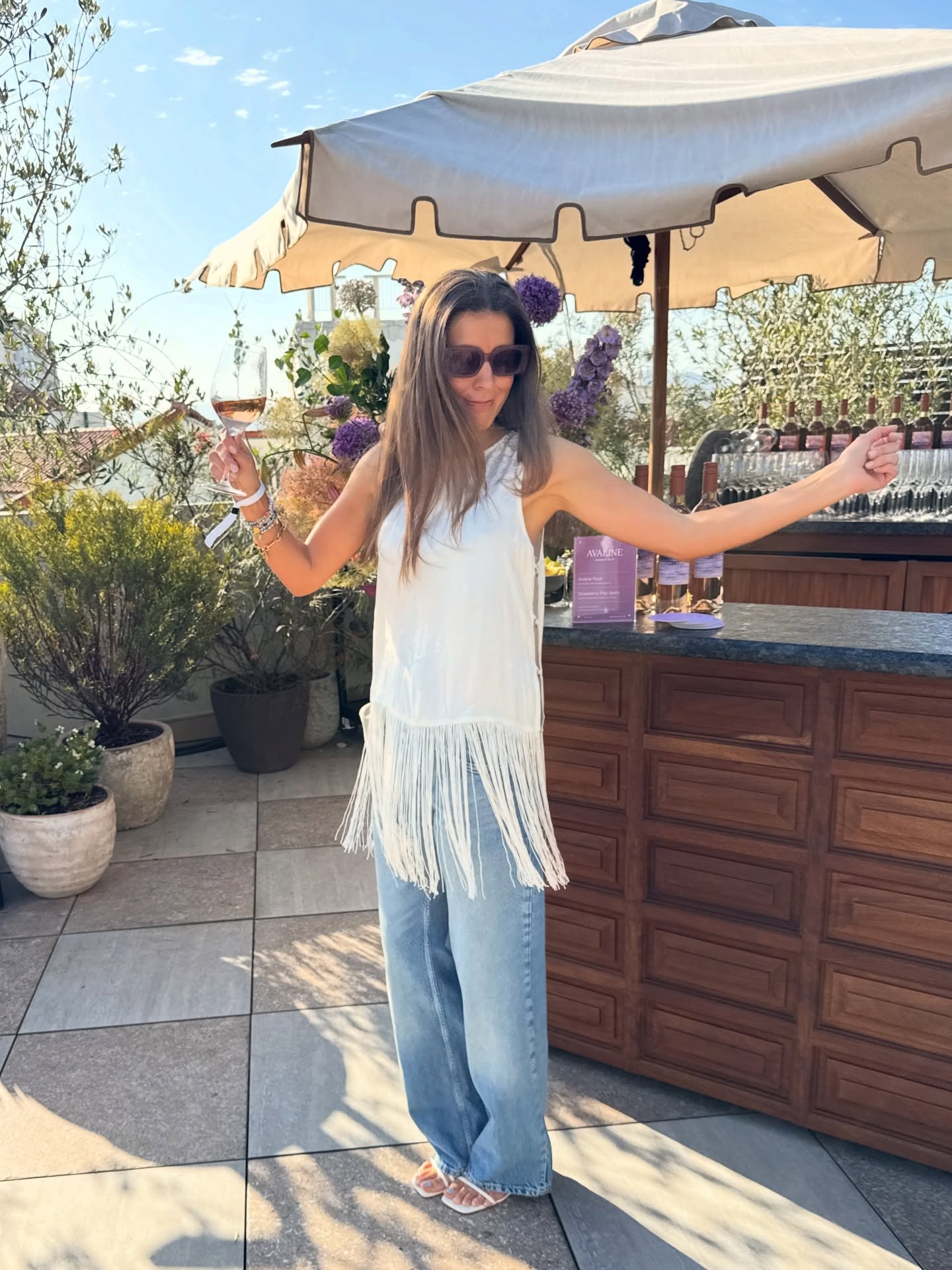 Woman in a fringe top and jeans