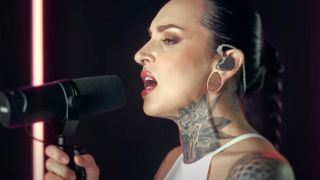Tatiana Shmayluk singing into a microphone in a studio in 2025