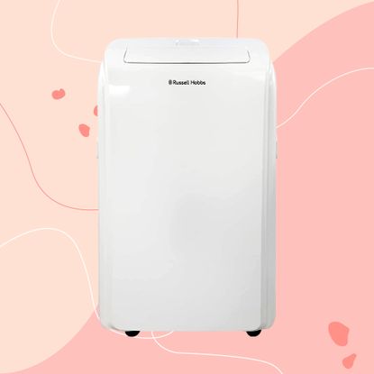 The white Russell Hobbs RHPAC11001 Portable Air Conditioner on a pink background