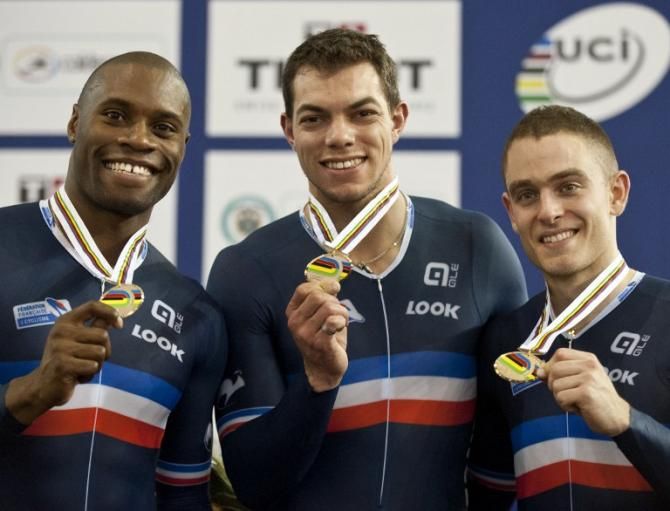 France's Gregory Bauge (L), Kevin Sireau (C) and Michael D'almeida celebrate their bronze medals for the Men's Team Sprint