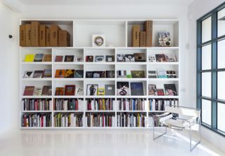 White bookshelves inside Arcana: Books on the Arts