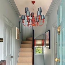 blue hallway with blue chandelier