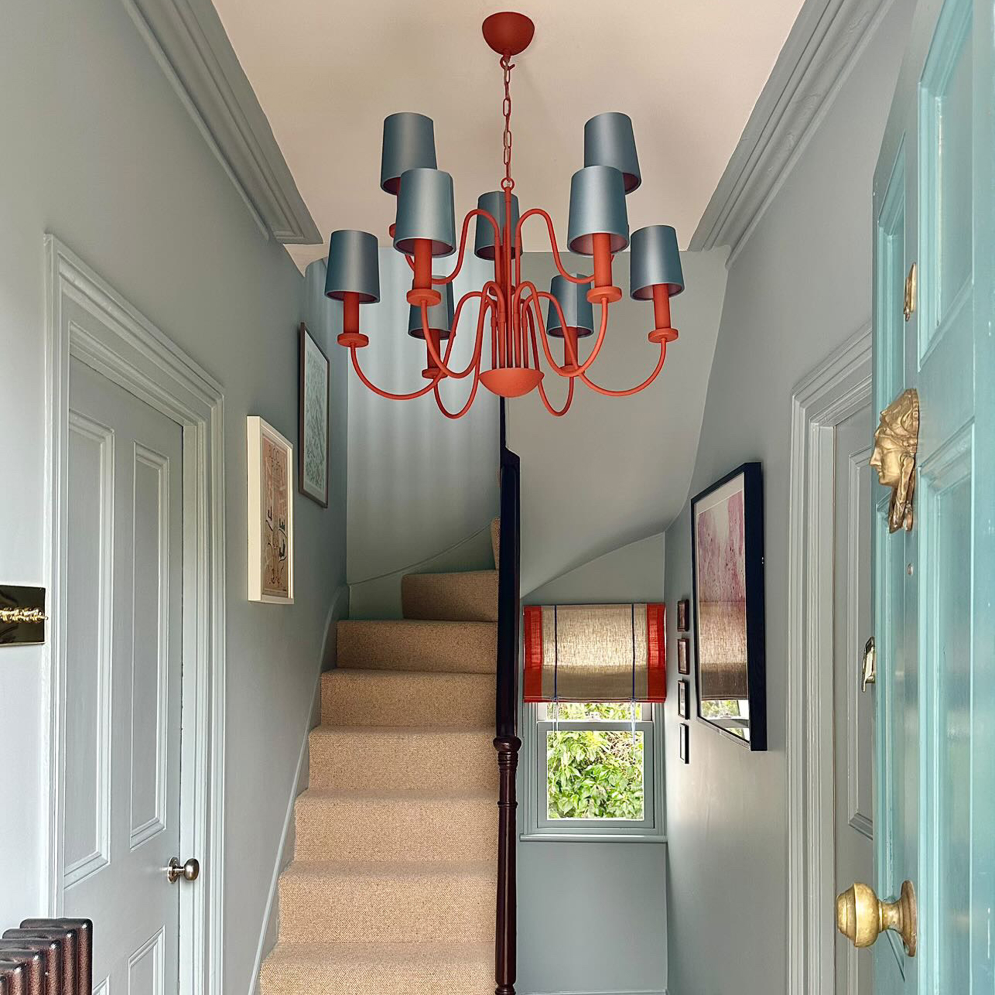 blue hallway with blue chandelier