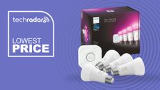 Philips Hue starter kit with box on purple background with white text reading 'TechRadar Lowest Price'