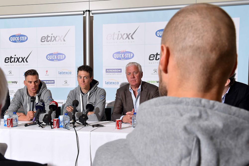 Boonen watches his teammates address the press.