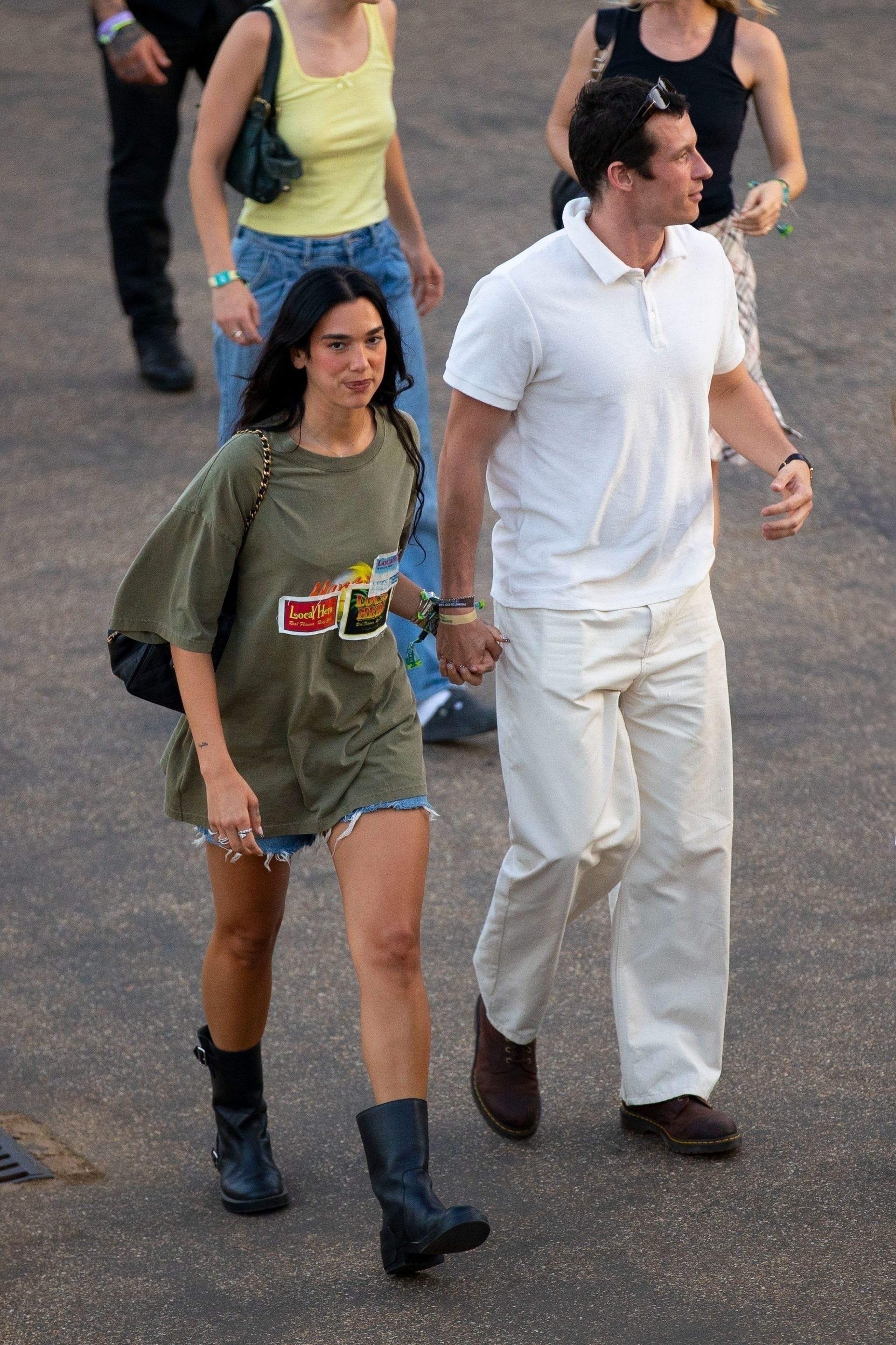 Dua Lipa wearing denim shorts with biker boots