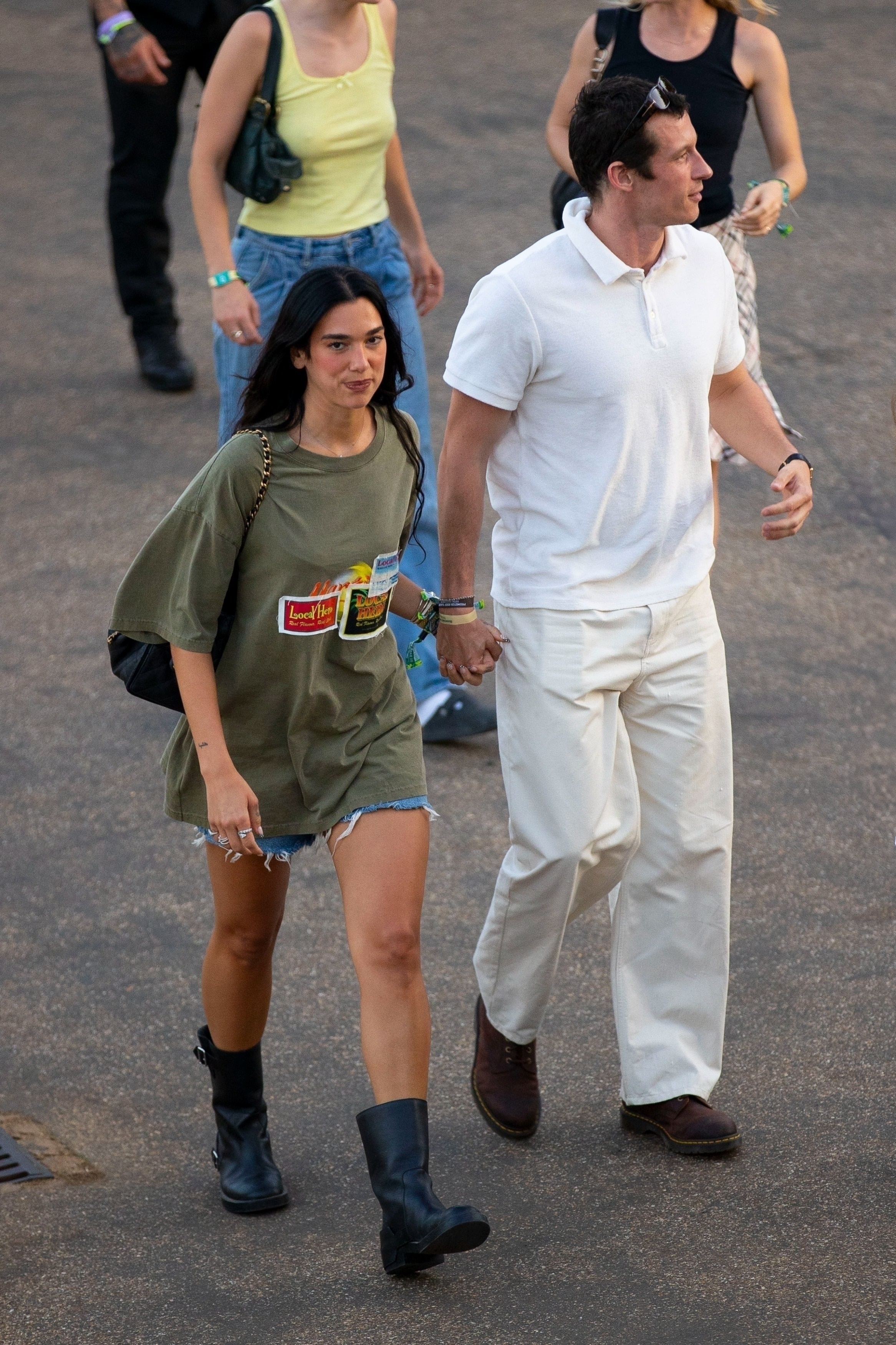 Dua Lipa wearing denim shorts with biker boots