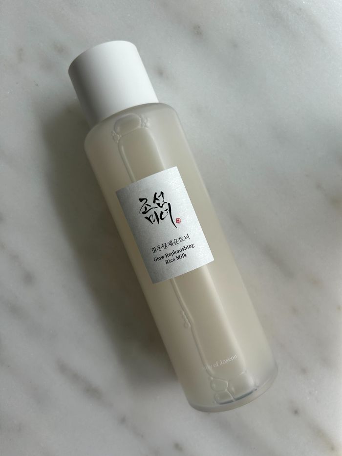 The Beauty Of Joseon Glow Replenishing Rice Milk Toner on a mabrle table