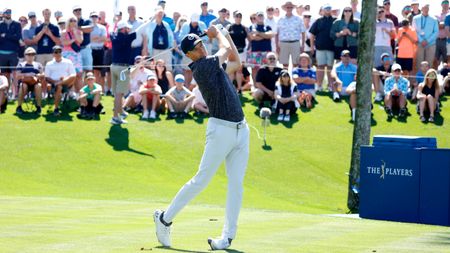 Jordan Spieth plays an iron shot at The Players Championship