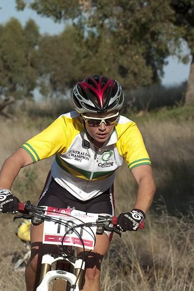 Rebecca Henderson heads towards victory in the women's under 23 cross country.