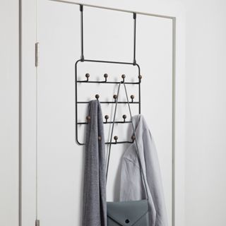 Black over the door hanger hanging items of clothing