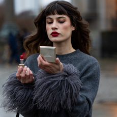  Lea Naumann doing her make up wearing full Prada look, Prada beauty lipstick & eyeshadow on November 27, 2023 in Berlin, Germany. 