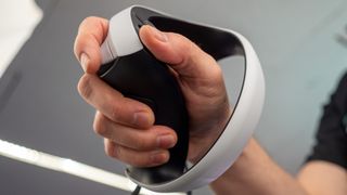 Holding the PlayStation VR2's Sense controllers