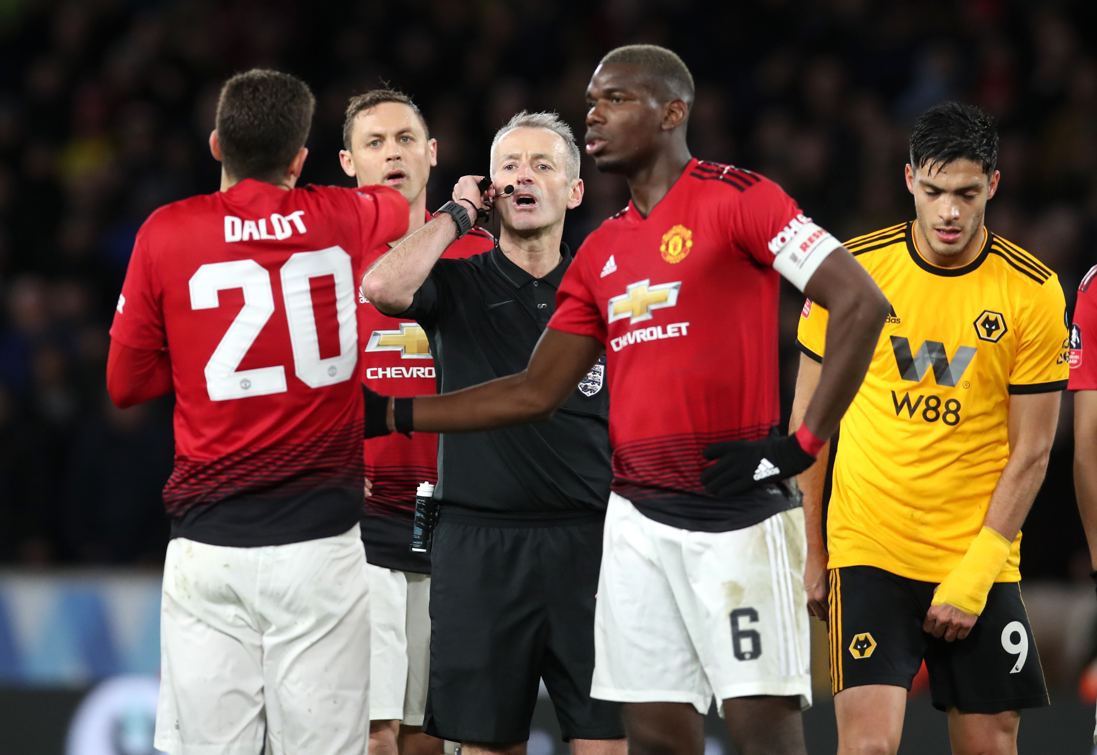 Diogo Dalot, left, appeals in vain for a penalty