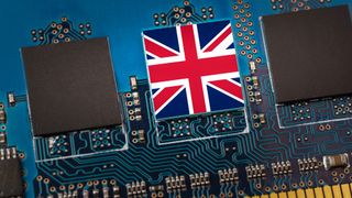 Three computer chips on a circuit board and the middle one has a union flag on it