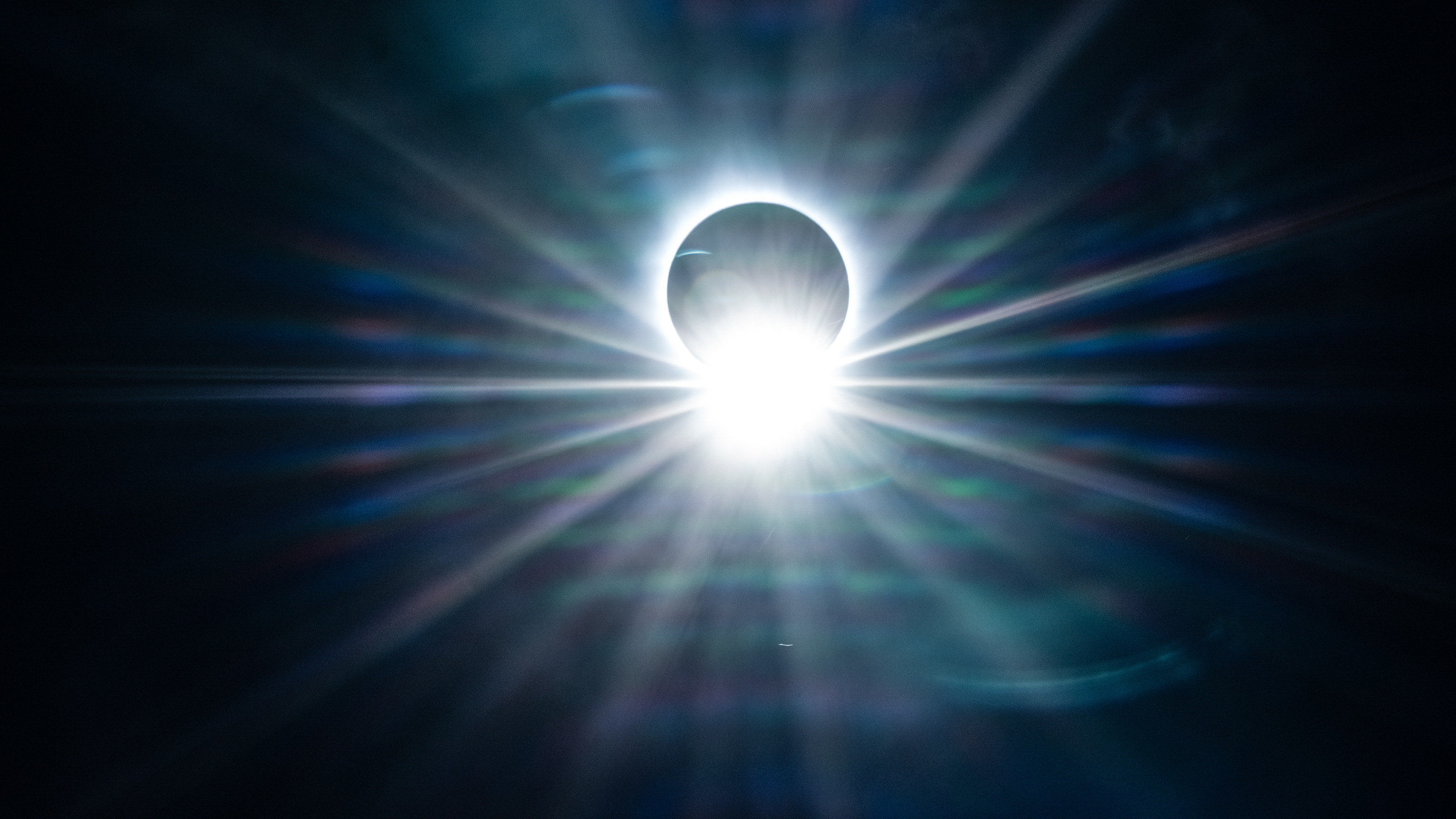 TUPPER LAKE, NEW YORK, UNITED STATES - 2024/04/08: View of total solar eclipse hosted by Adirondack Sky Center and Observatory at LP Quinn Elementary School. Total solar eclipse was visible across the United States with Western and Northern parts of New York State mostly in the path of the eclipse. Hundreds of people gathered on the grounds of LP Quinn Elementary School as Adirondack Sky Center is one of twelve locations nationwide providing NASA (National Aeronautics and Space Administration) with a live video feed of the eclipse. (Photo by Lev Radin/Pacific Press/LightRocket via Getty Images)