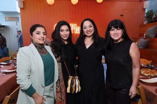 Mina's List executive director Teresa Casale, Shiza Shahid and two women posing in front of dinner tables