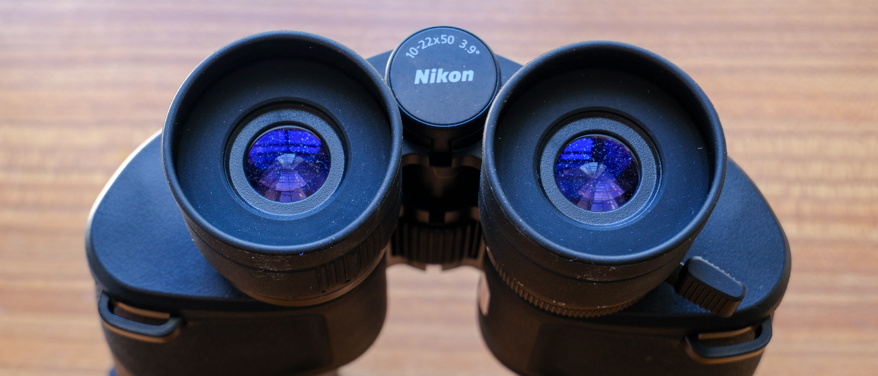 The eyecups and zoom level of the Nikon Action Zoom 10-22x50 binoculars.