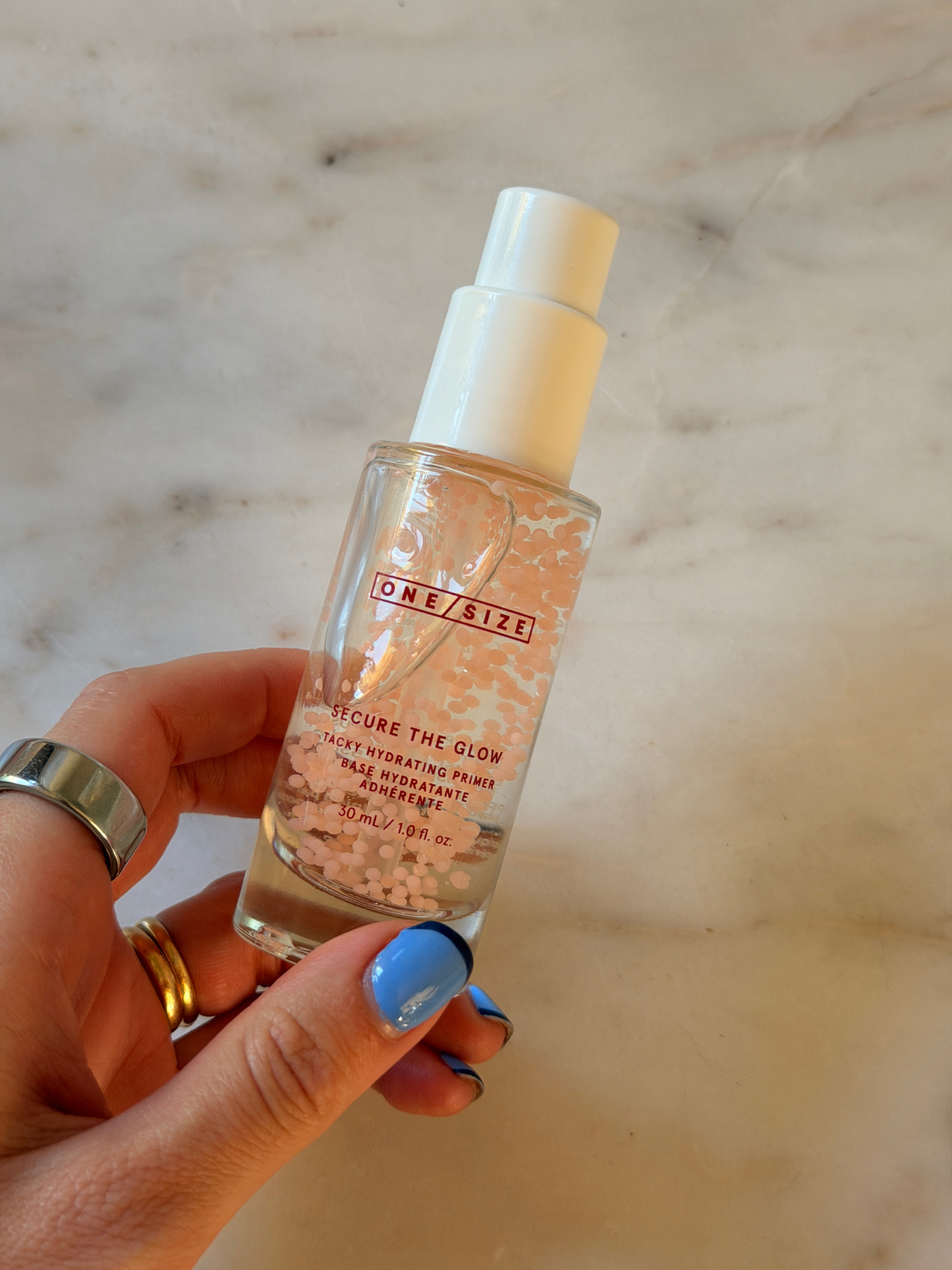Freelance beauty editor Grace Day holding the One/Size primer.