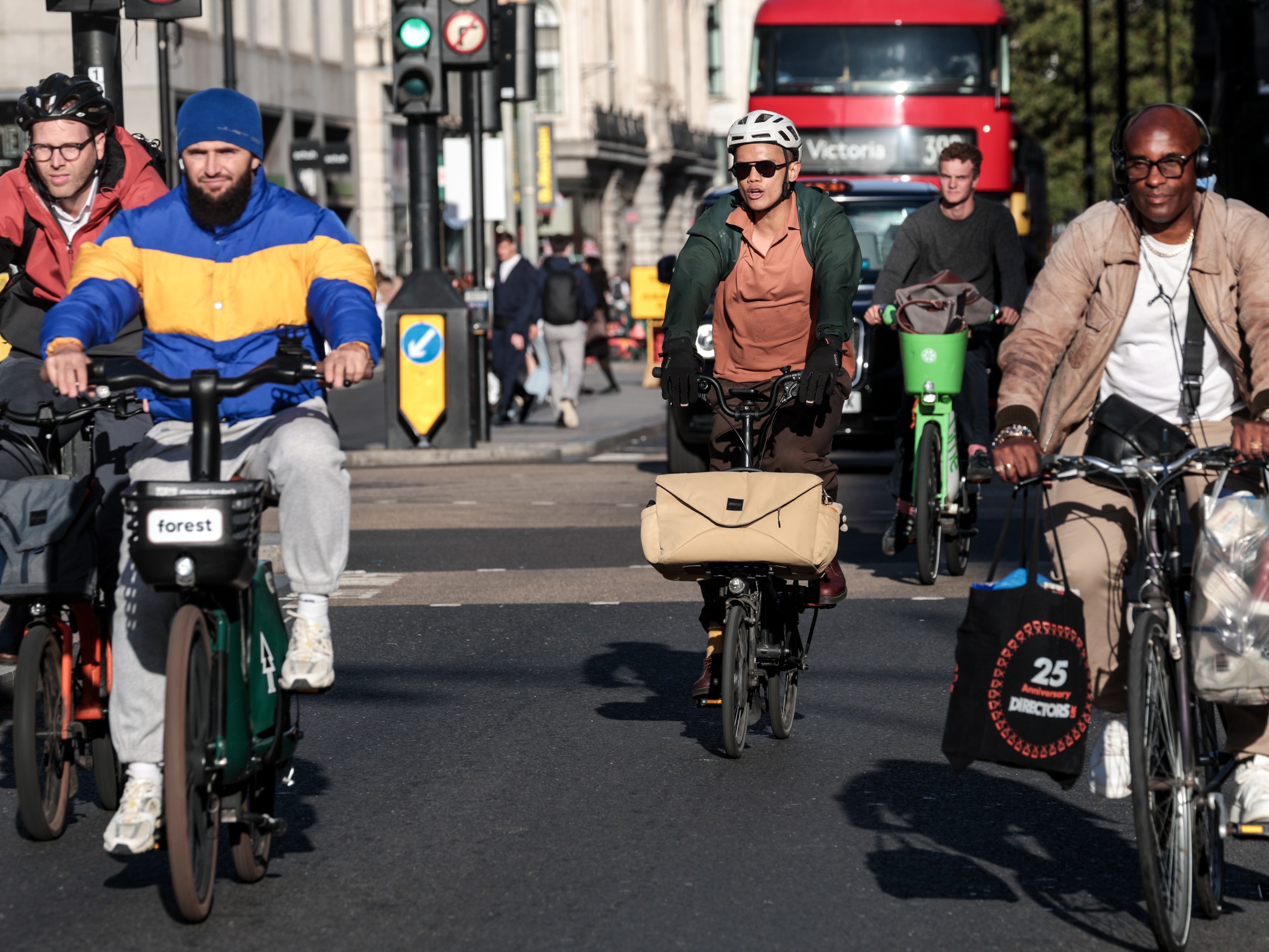 Commuters ride bikes in London