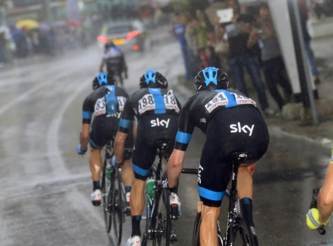 Team Sky were forced to wait for Wiggins after the Tour winner crashed and was dropped in the rain