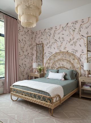 girl's bedroom with rattan bed and pink floral wallpaper