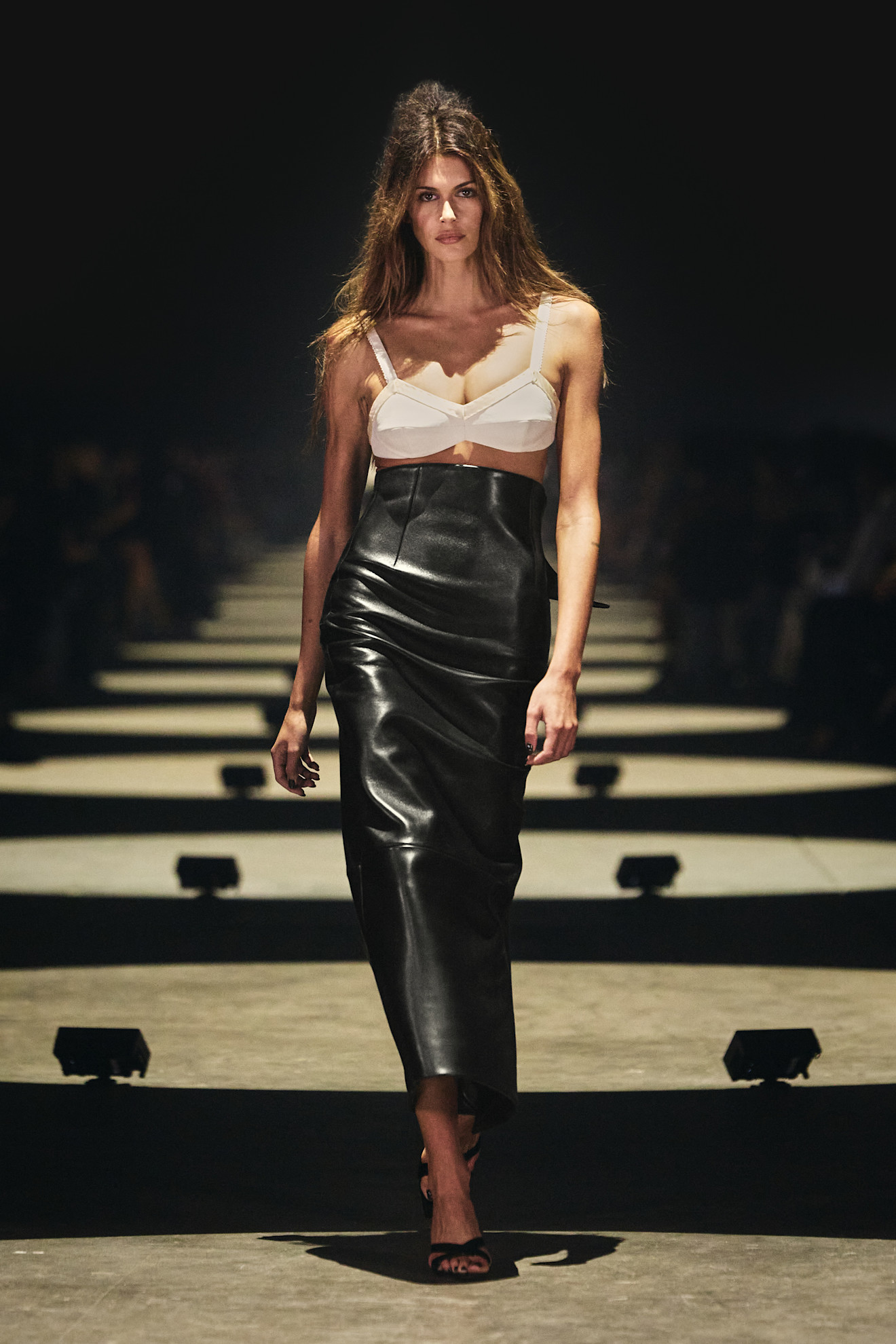 Spring/summer 2027 model wearing a bra top on the runway during fashion month.