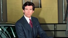 pierce brosnan on a yellow background