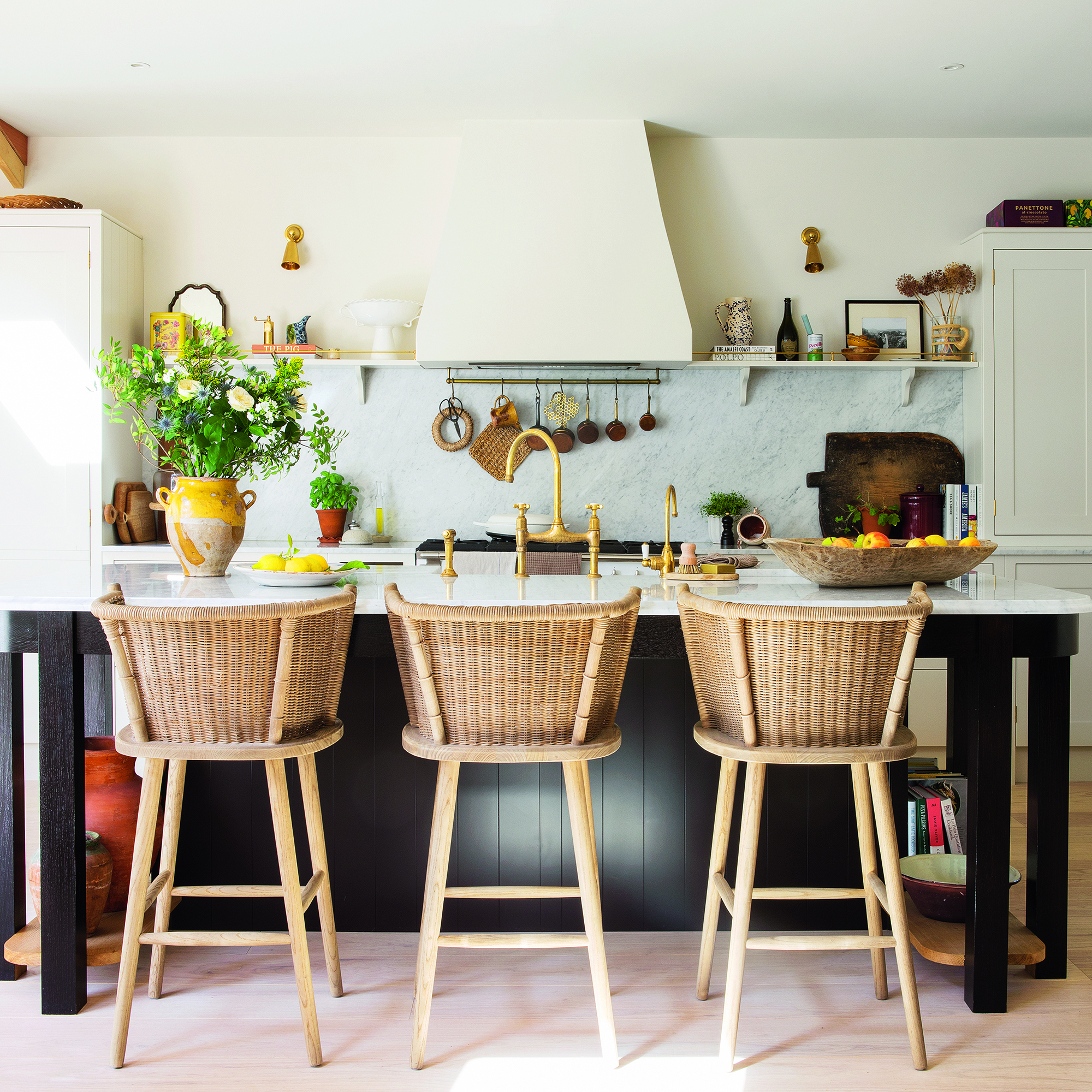 Classic kitchen with island and rattan chairs