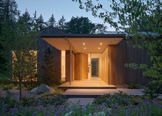 Interurban Residence, a low timber home with minimalist style and light wood tones