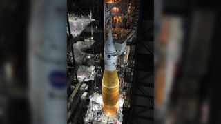 Inside the Vehicle Assembly Building at NASA’s Kennedy Space Center in Florida, work platforms are being retracted from around the Artemis I Space Launch System rocket and Orion spacecraft in preparation to roll out for testing.