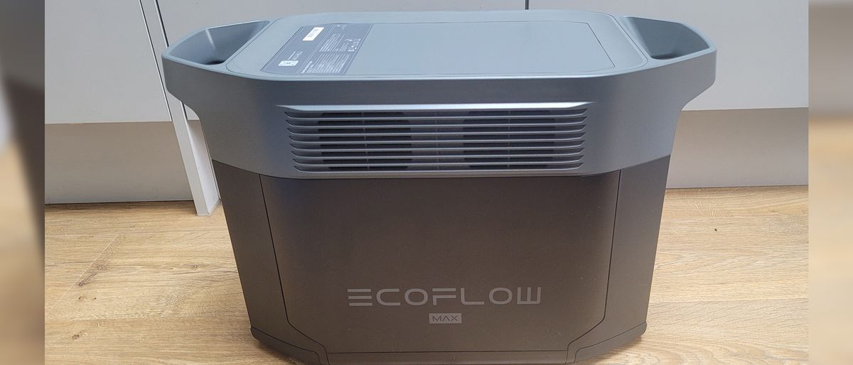 EcoFlow DELTA 2 Max power station on a wooden floor in front of gray cabinets