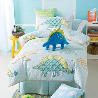 childrens bedroom with dinosaur soft toy and cotton duet cover set with dinosaur